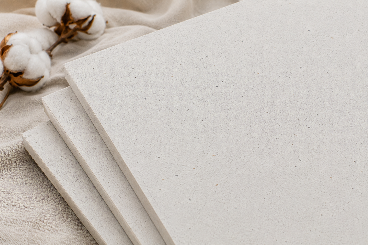 Recycled cotton rigid board sheets for sustainable packaging