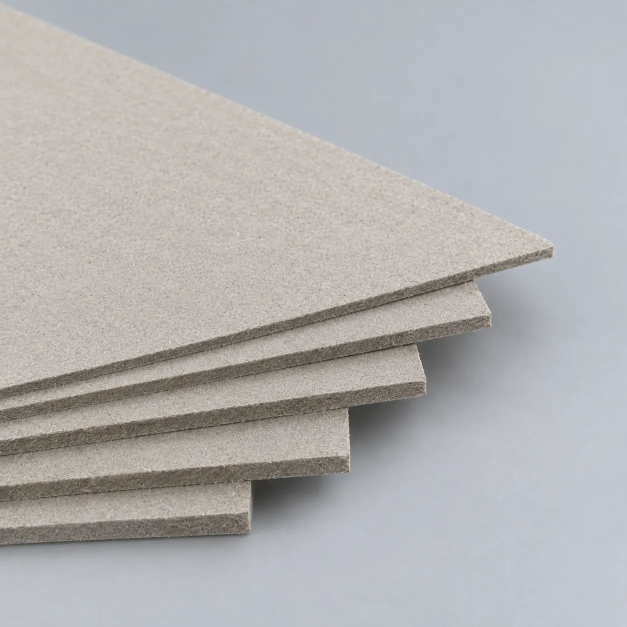 Recycled cotton rigid board sheets for sustainable packaging